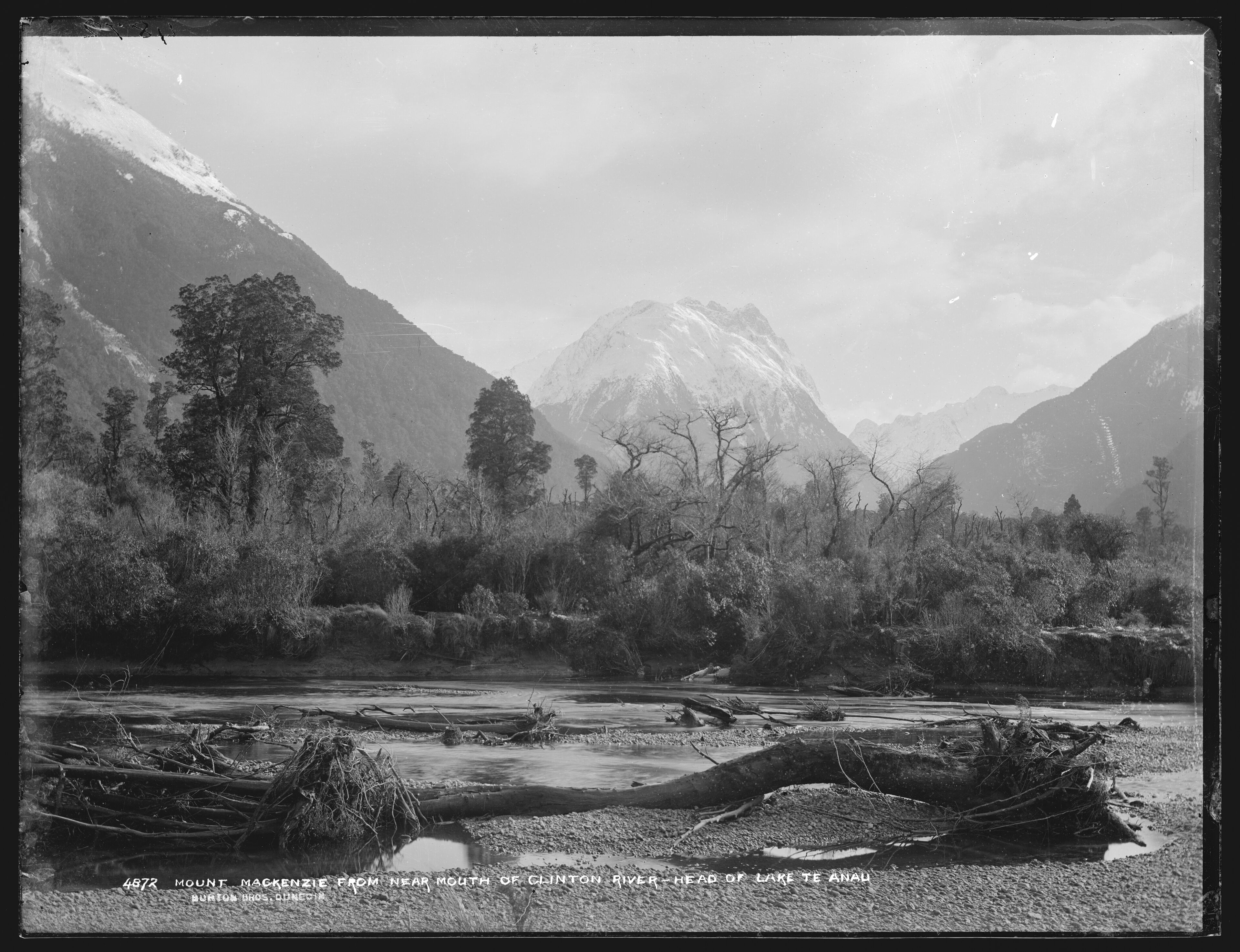 Not modern-day Mount Mackenzie, but an un-named peak. The branches of the Clinton River meet below the central peak and run to Lake Te Anau, where this photograph was taken.
