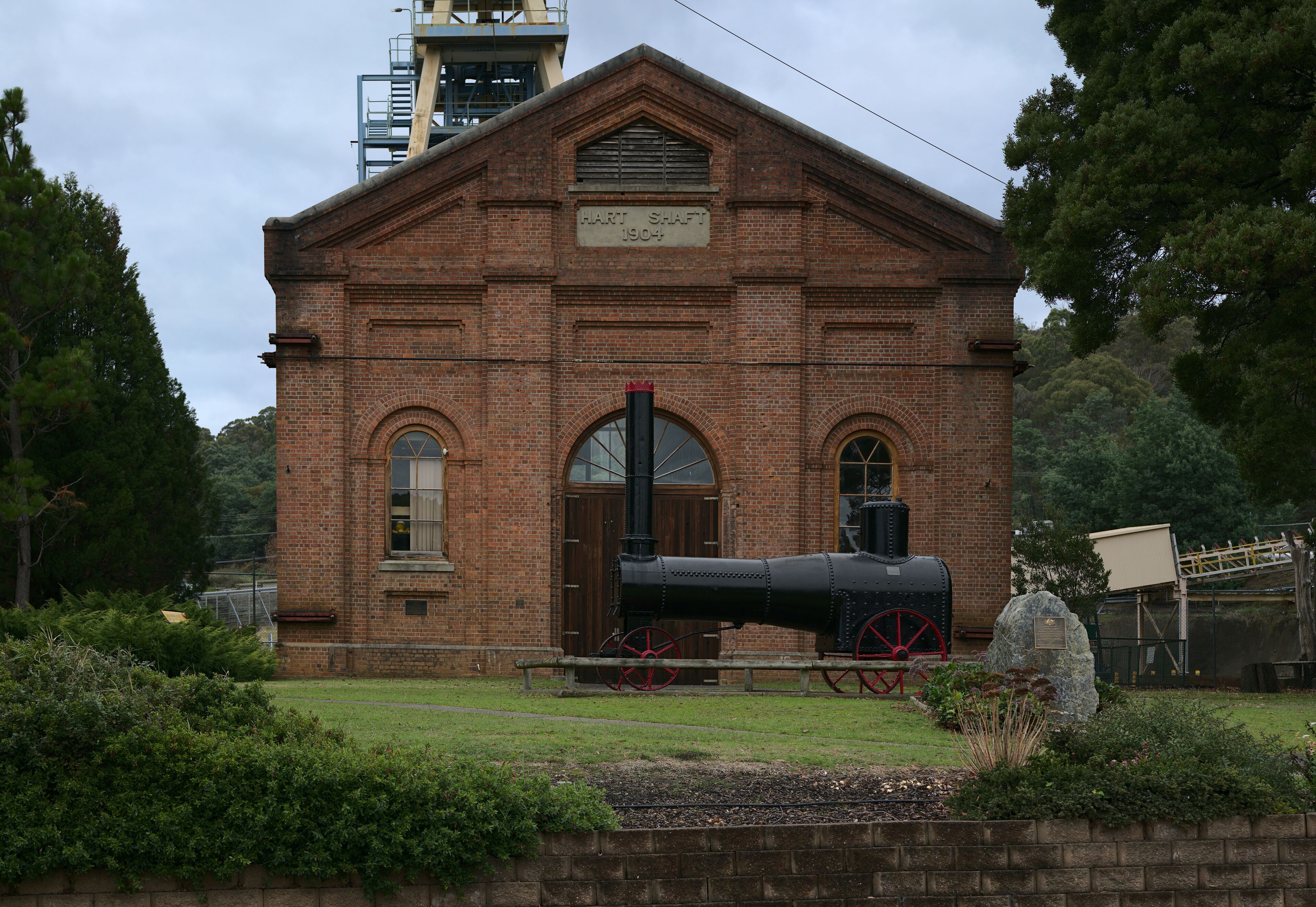 Facade from an original mine shaft in front of the later shaft.