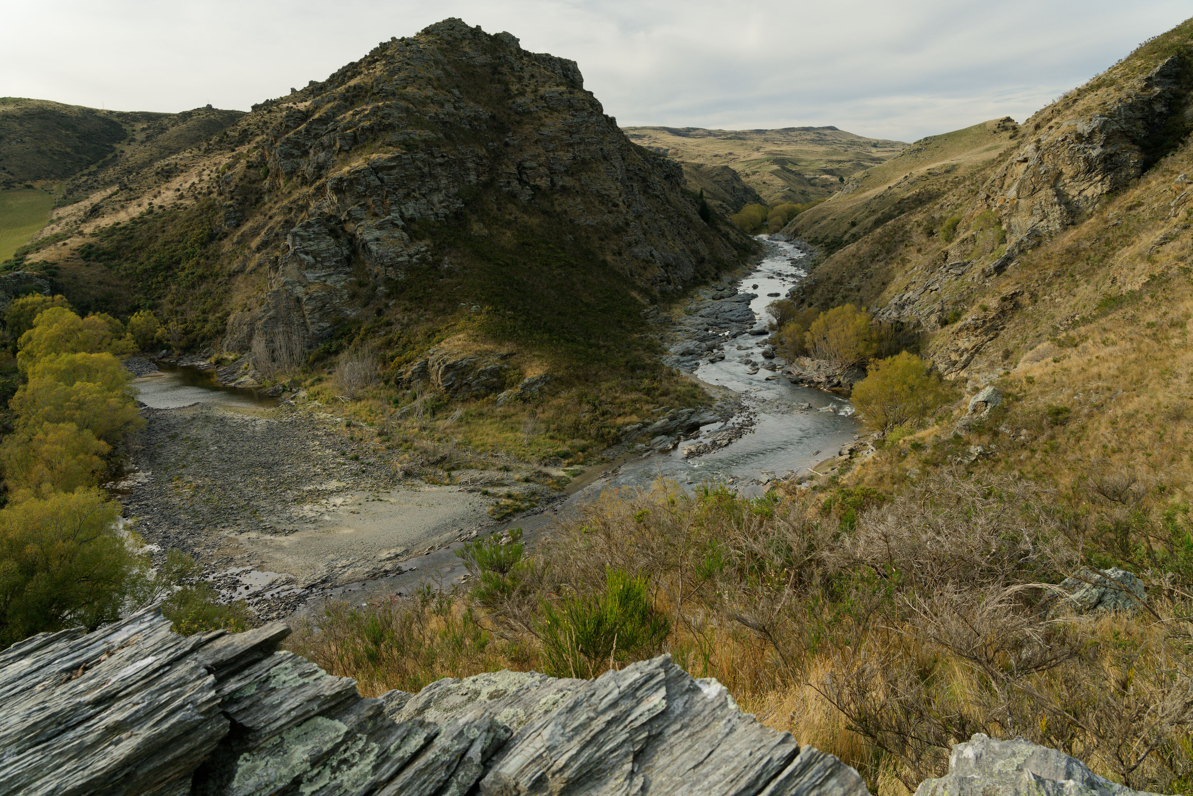 Looking downstream from the tunnel outlet. The line of willow trees on the left mark out the diverted river bed.
